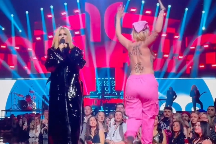 Avril Lavigne Flicks Topless Protestor's Boob at JUNO Awards: Get the Fuck  Off, Bitch
